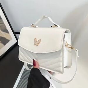 Chic White Crossbody Bag with Butterfly Detail